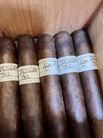 A close up of some cigars in a box