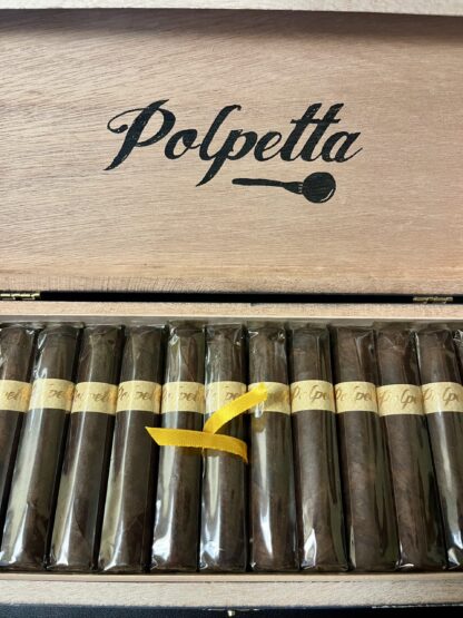 A close up of some cigars in front of a box